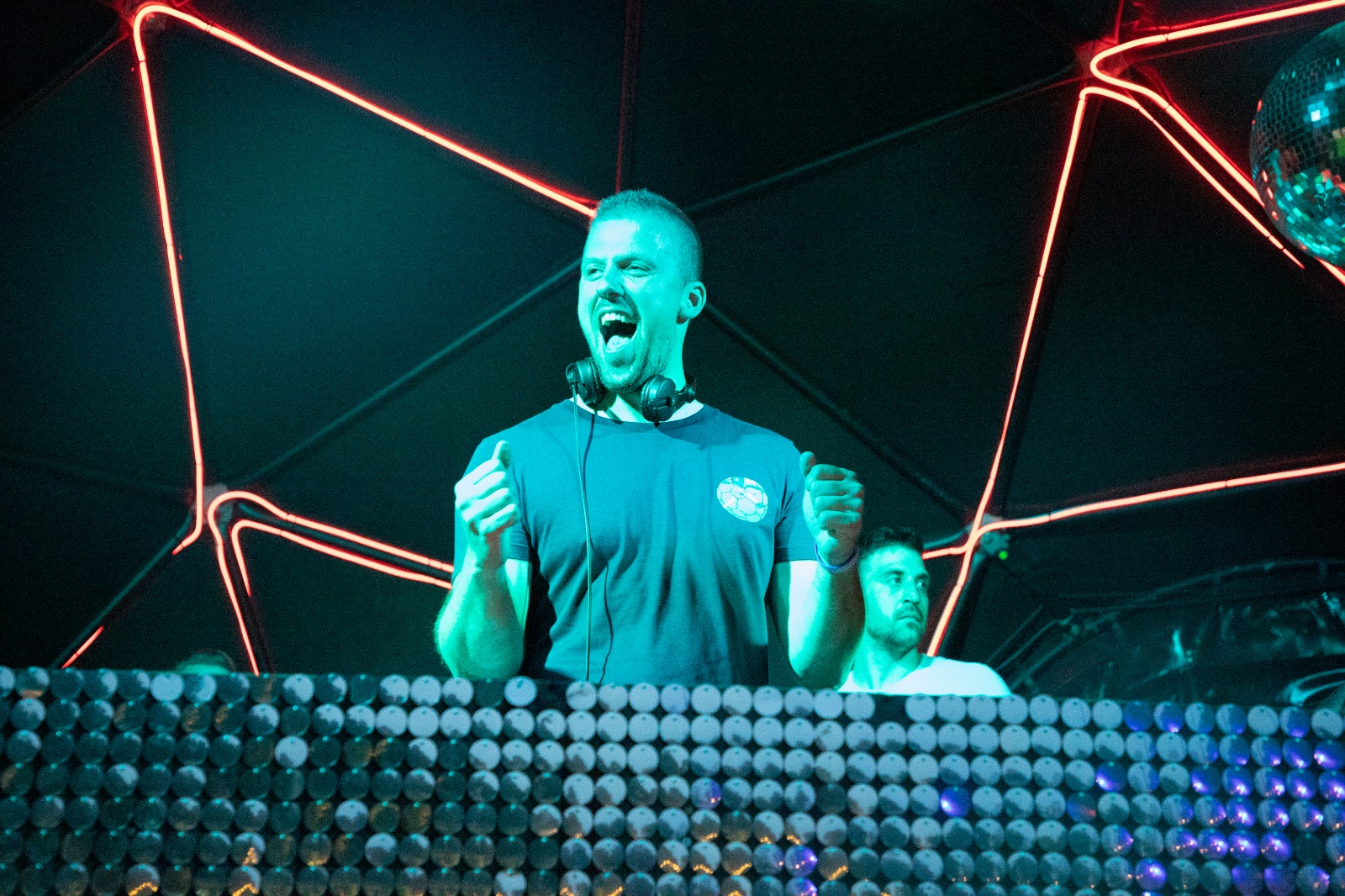 DJ Ivan Škrinjarić mixing music at a live event