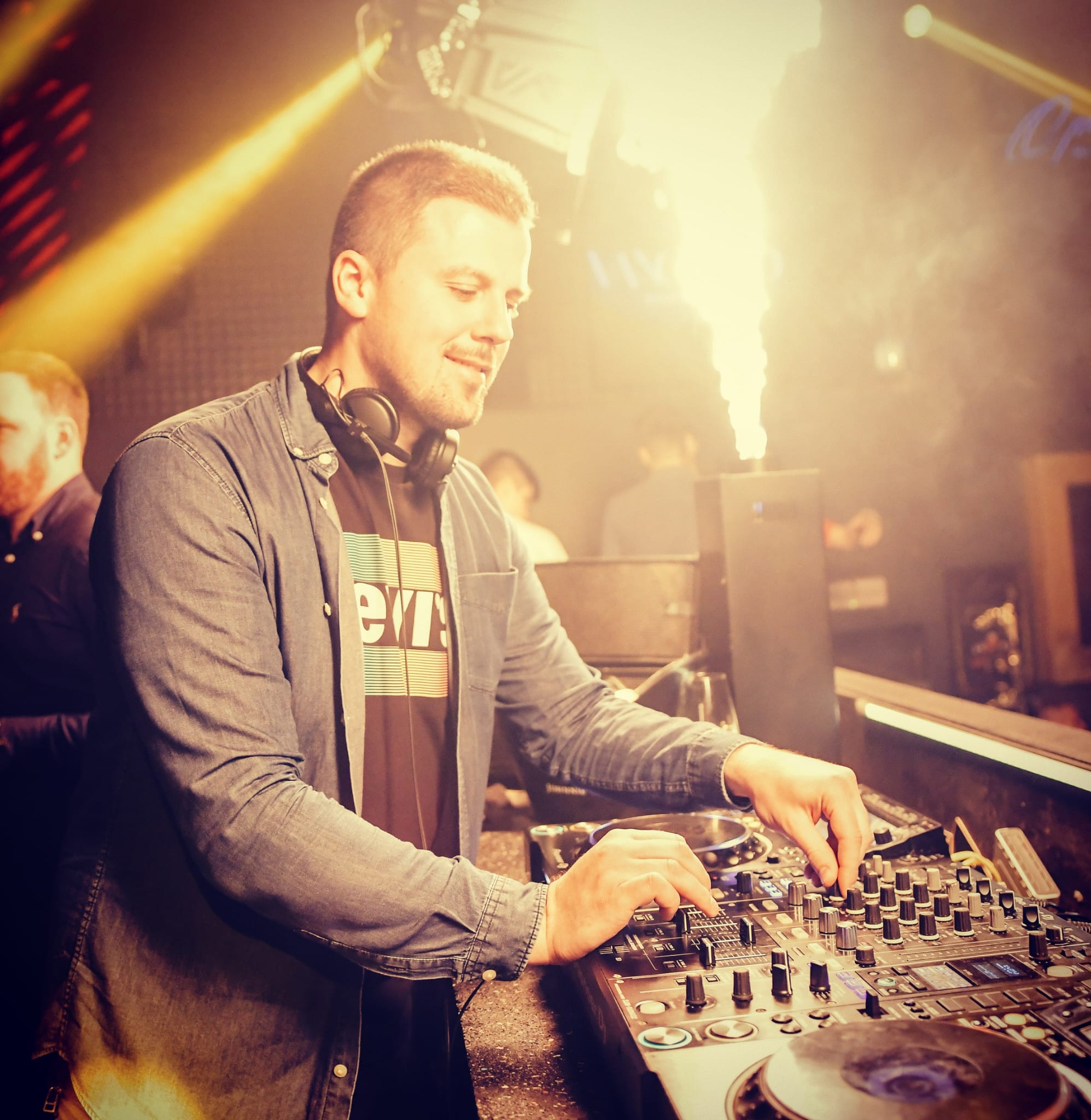 DJ Ivan Škrinjarić mixing music at a live event